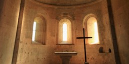 stone church with altar and cross