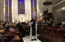 Father Joseph Tedesco speaking in Luthern church at Una Sancta concedrt