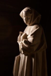 Stature of St. Bernard, holding a image of a Church