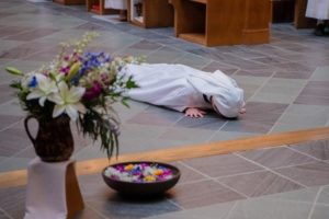 Sr Karla prostrate on floor of St. Mary's Church