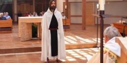 Br. Scott stands before the altar at Guadalupe Abbey