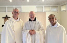 New Novices smile with abbot