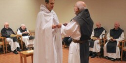 Br. Kyle of Mepkin receives Novice habit from superior Fr. Joe