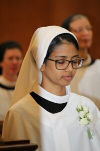 Sister Ashwini in cloak preparing for solemn profession