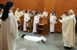 Sister Ashwini prostrate for Solemn Profession as priest blesses her