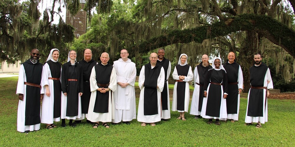 Group photo of the monks and nun participants of the US Region 2024 Juniors Conference held at Mepkin Abbey
