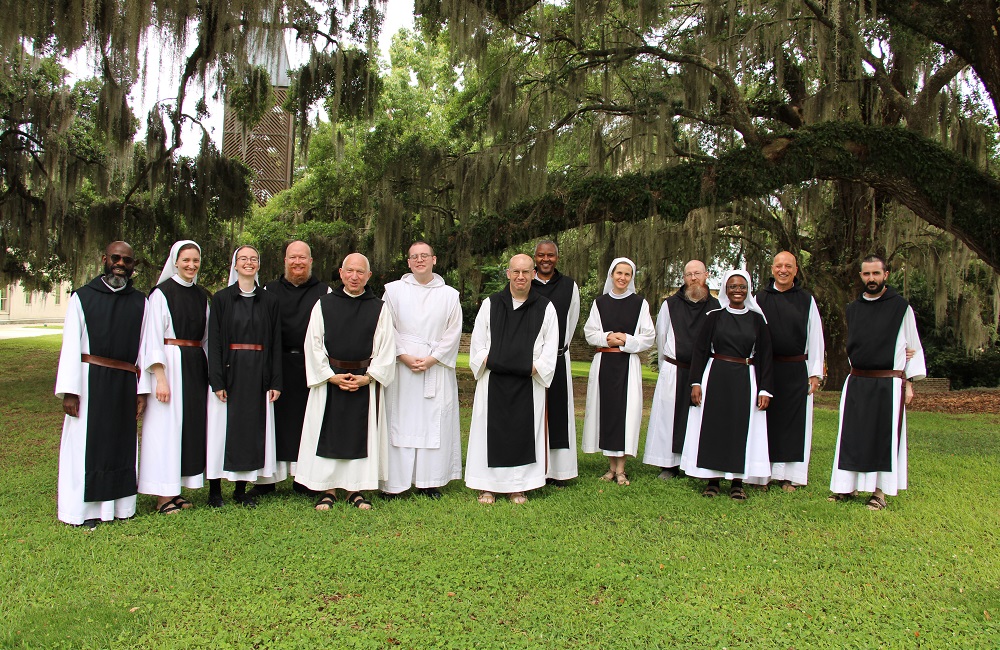 Group photo of the monks and nun participants of the US Region 2024 Juniors Conference held at Mepkin Abbey