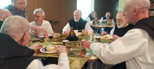 Monks of Genesee enjoyuing a feast on the occasion on Brother Alberic's 100th Birthday