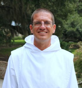 Fr. Stephen smiling, dressed in Novice habit